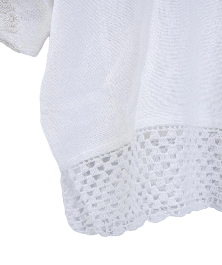 Hand-loomed and hand-embroidered blouse crochet hem detail