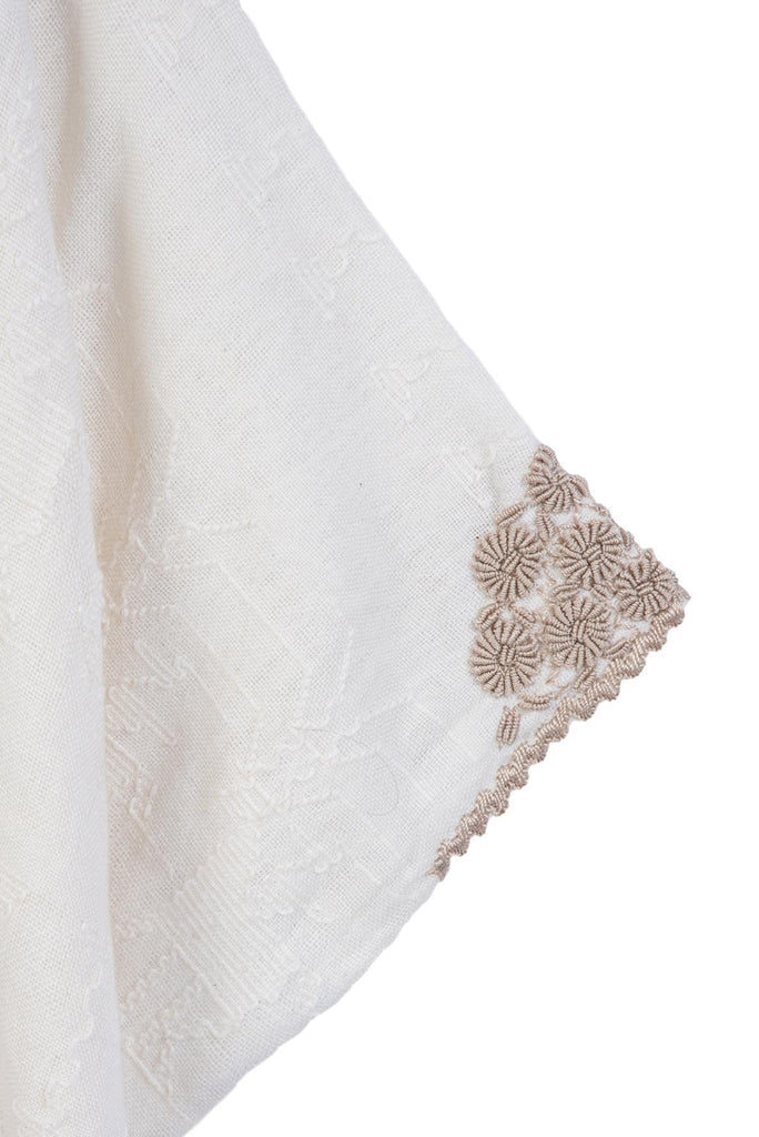 Hand-loomed and hand-embroidered tunic ivory blouse sleeve detail
